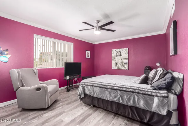 a bedroom with a bed and a couch