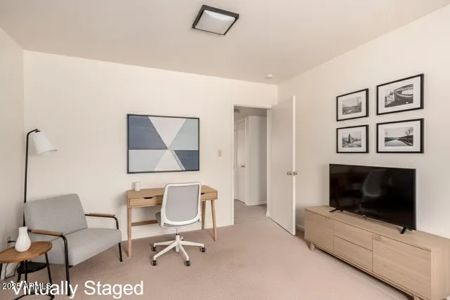 a living room with furniture and a dining table with garden view