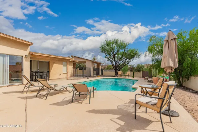 a view of a backyard with sitting area