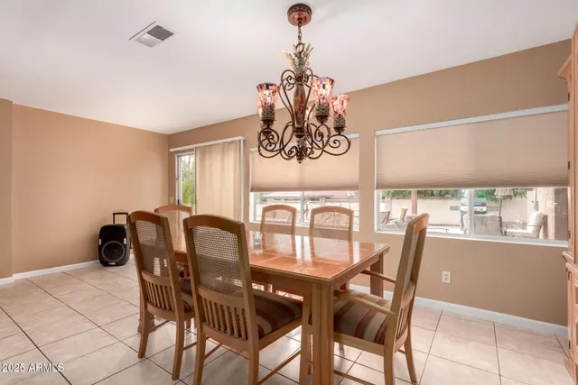 a view of a dining room with furniture window and outside view