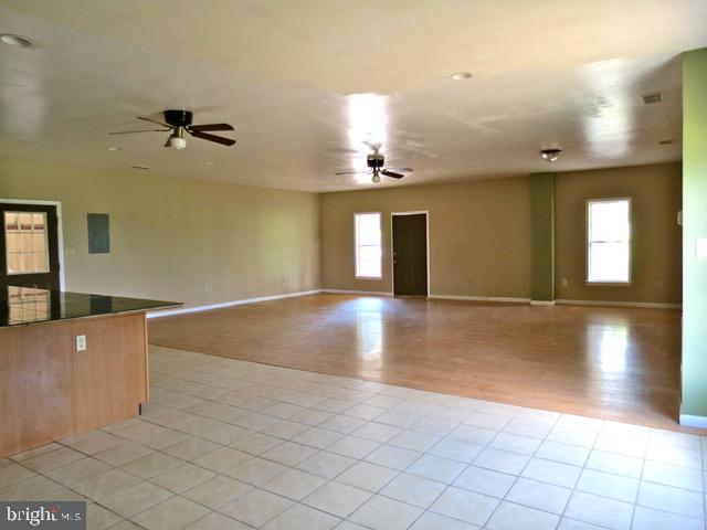 8780 Old Stillhouse Road Rixeyville, VA 22737 - Photo 15 of 28 an empty room with a empty space and windows