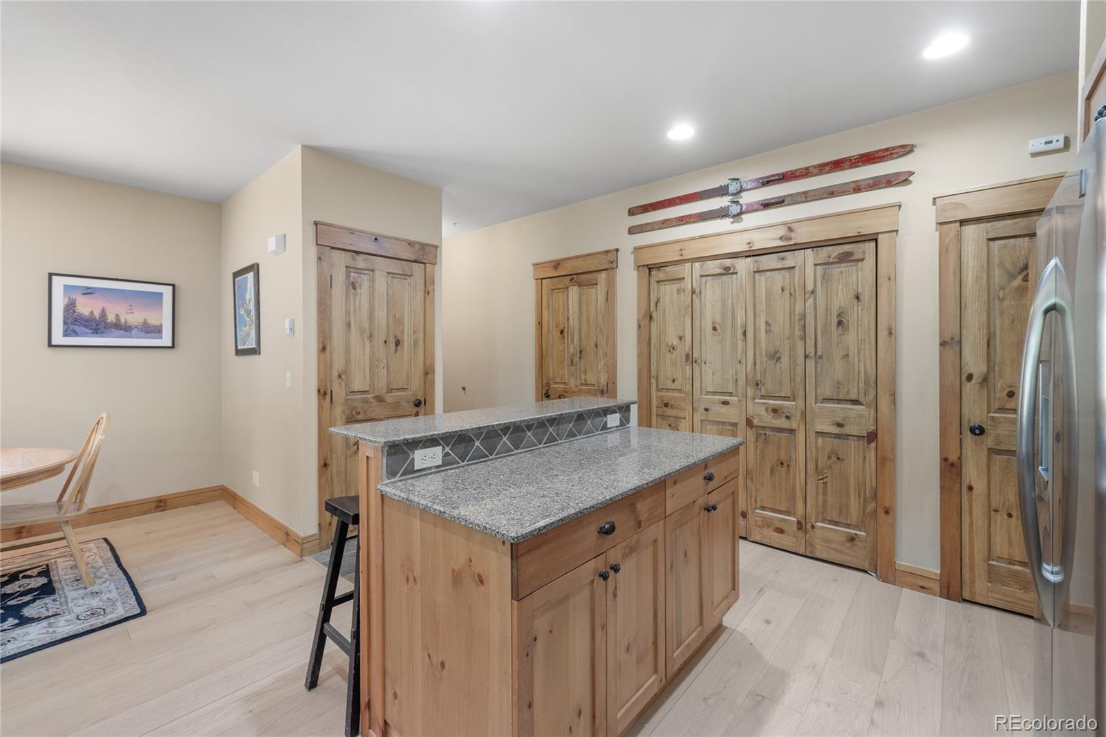 14 Arabella Drive, Unit 6516 Dillon, CO 80435 - Photo 12 of 39 a bathroom with a granite countertop sink a mirror and a shower