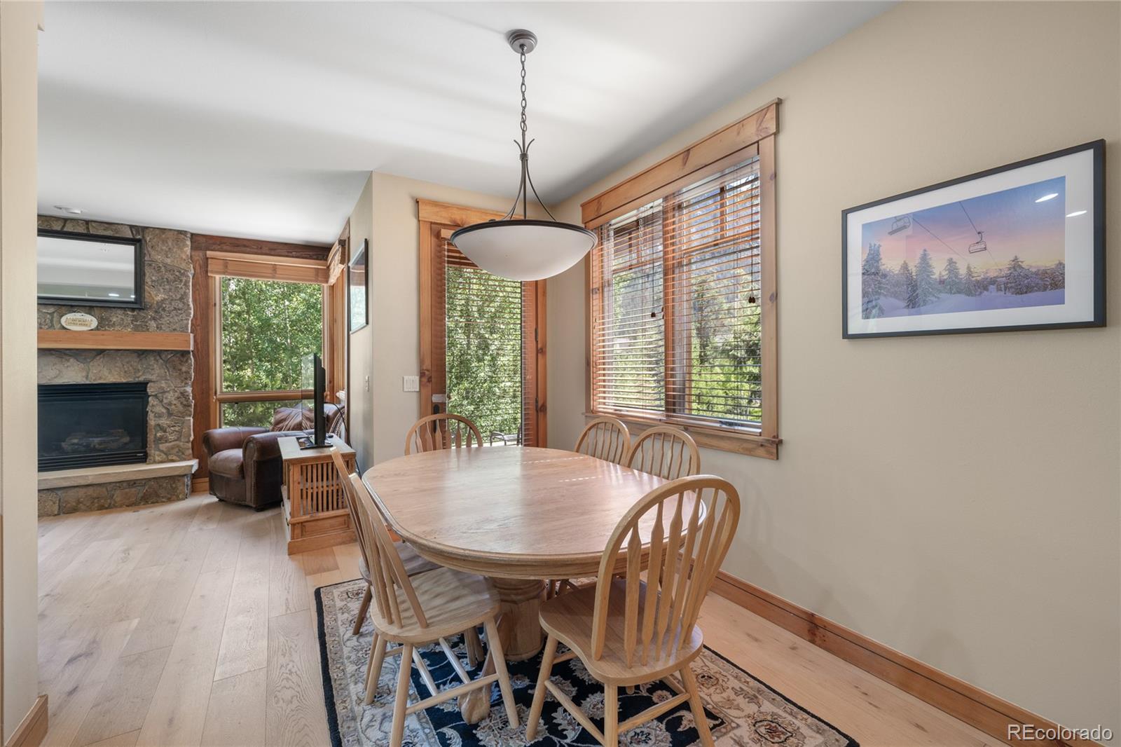 14 Arabella Drive, Unit 6516 Dillon, CO 80435 - Photo 13 of 39 a dining room with furniture a chandelier and wooden floor