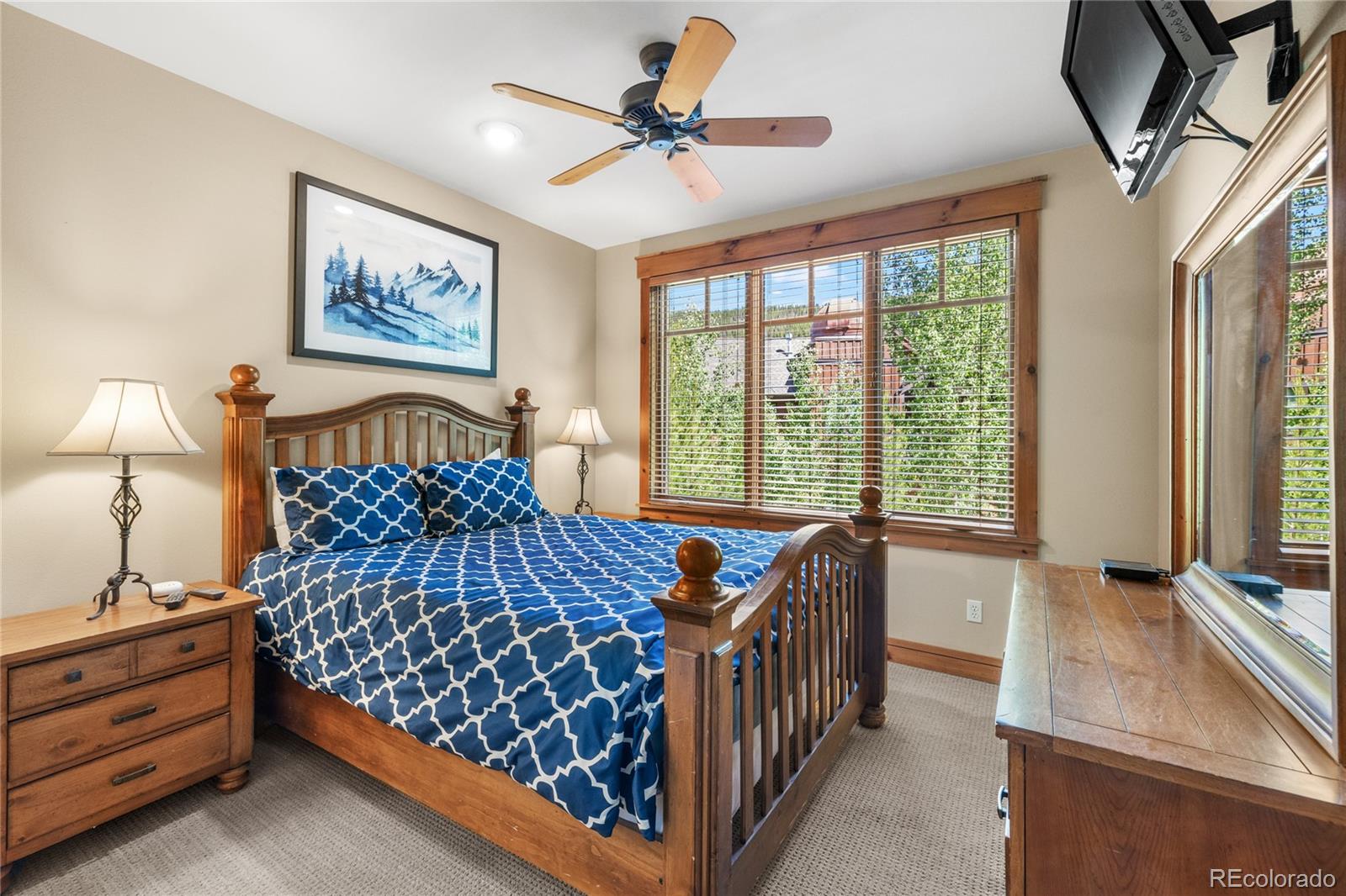 14 Arabella Drive, Unit 6516 Dillon, CO 80435 - Photo 19 of 39 a bedroom with a bed and a chandelier