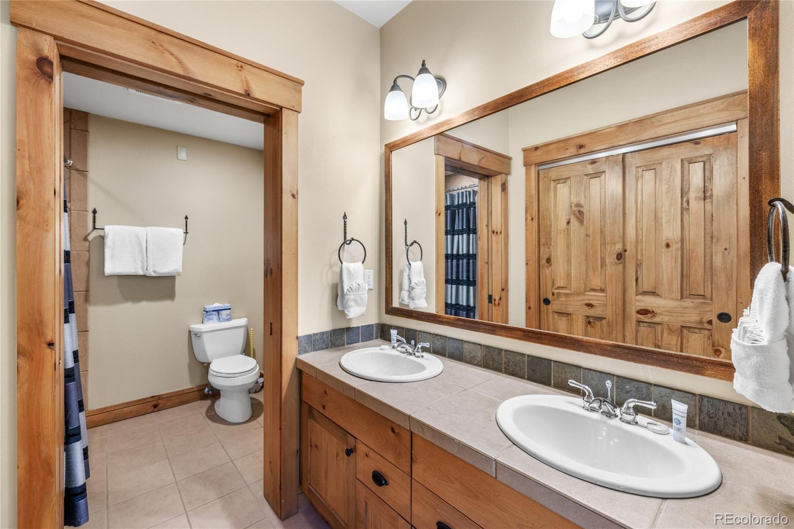 14 Arabella Drive, Unit 6516 Dillon, CO 80435 - Photo 21 of 39 a bathroom with a sink double vanity and a toilet