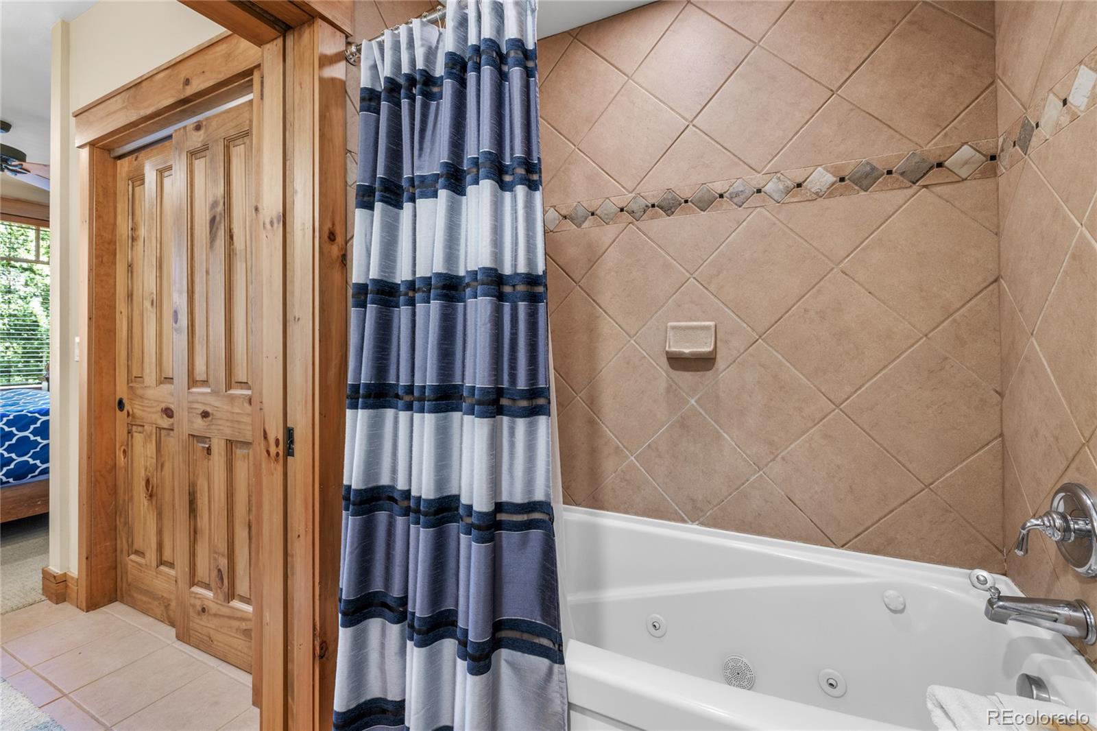 14 Arabella Drive, Unit 6516 Dillon, CO 80435 - Photo 22 of 39 a bathroom with a bathtub and shower
