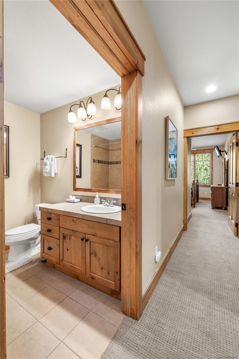 14 Arabella Drive, Unit 6516 Dillon, CO 80435 - Photo 24 of 39 a large bathroom with a large mirror vanity and a sink