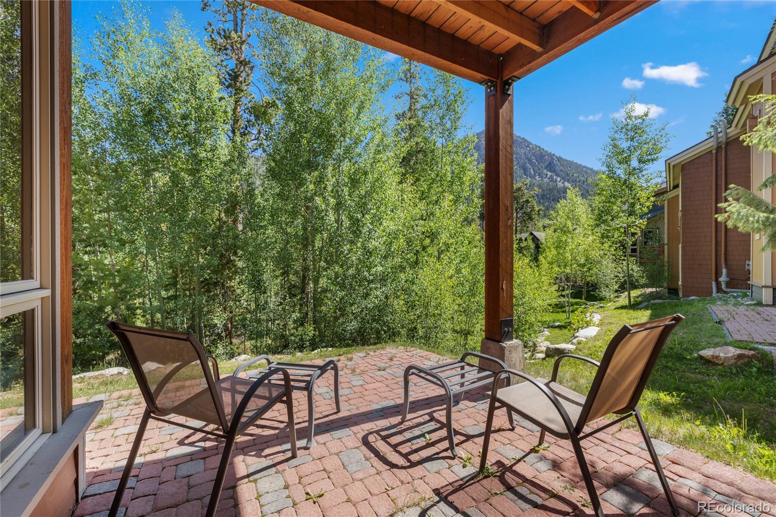 14 Arabella Drive, Unit 6516 Dillon, CO 80435 - Photo 26 of 39 a view of an outdoor sitting area with furniture and backyard