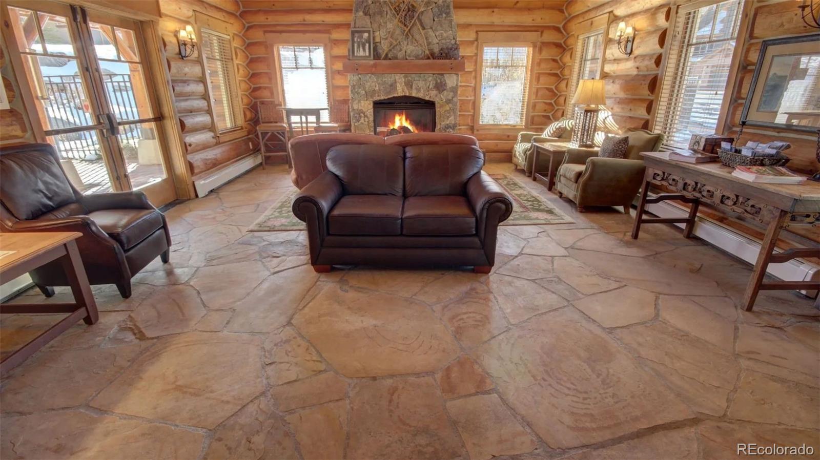 14 Arabella Drive, Unit 6516 Dillon, CO 80435 - Photo 32 of 39 a living room with furniture and a fireplace