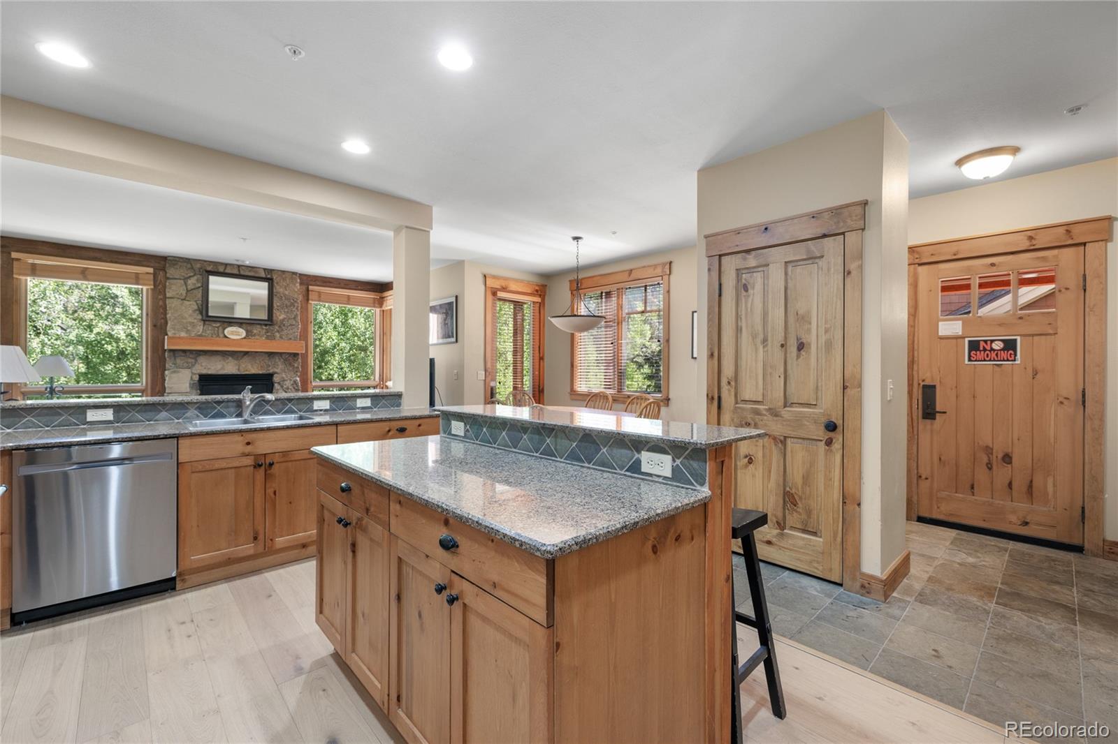 14 Arabella Drive, Unit 6516 Dillon, CO 80435 - Photo 9 of 39 a kitchen with stainless steel appliances granite countertop a sink and a refrigerator