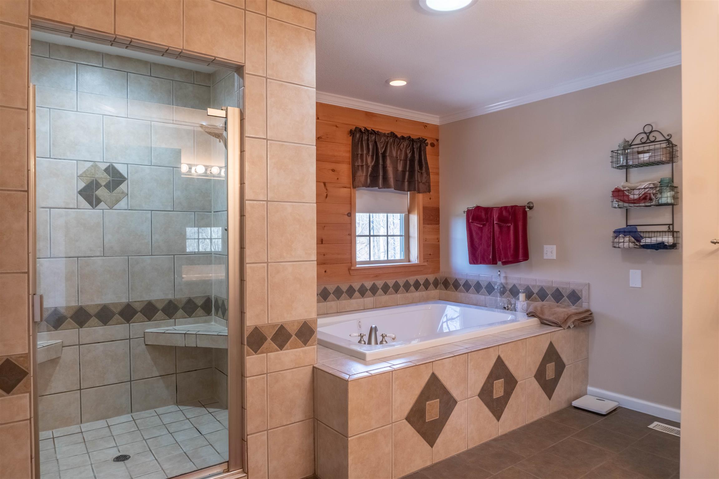 2141 Cunningham Road Cookeville, TN 38506 - Photo 14 of 30 Master bath features separate tile shower and whirlpool tub! Closet is located in the bathroom.