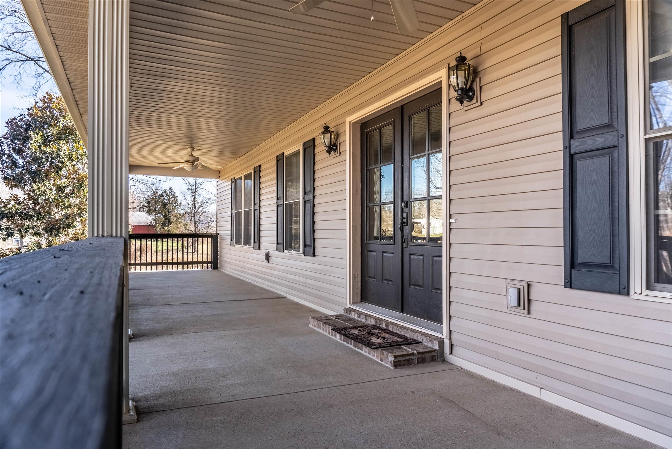 2141 Cunningham Road Cookeville, TN 38506 - Photo 3 of 30 Beautiful rocking chair front porch with two ceiling fans for those warm summer days.