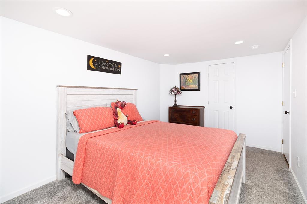 1815 South Oak Street Brady, TX 76825 - Photo 15 of 34 a bedroom with a bed and a night stand