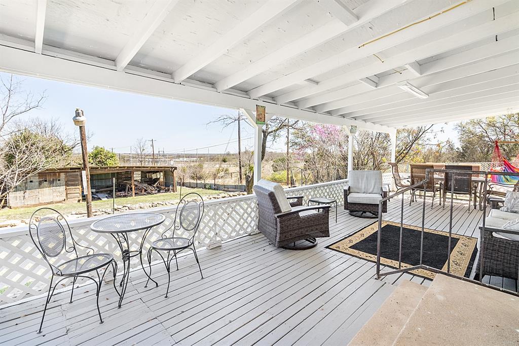 1815 South Oak Street Brady, TX 76825 - Photo 22 of 34 a outdoor space with patio the couches and chairs with wooden floor
