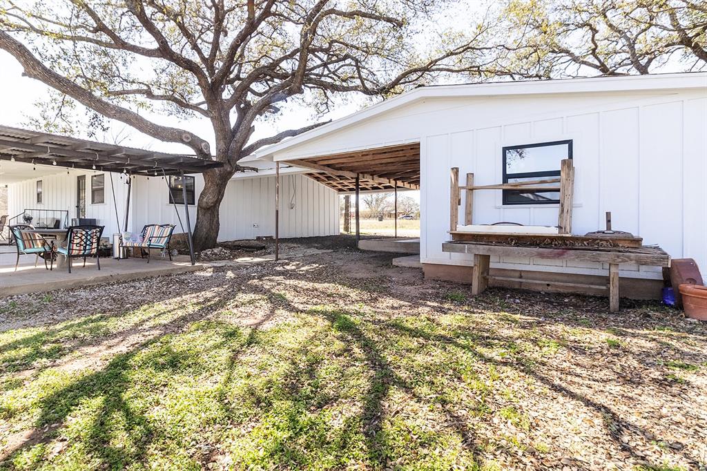 1815 South Oak Street Brady, TX 76825 - Photo 27 of 34 a backyard of a house with table and chairs