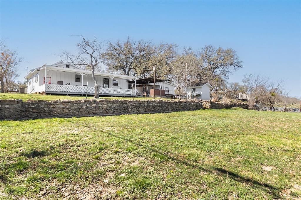 1815 South Oak Street Brady, TX 76825 - Photo 32 of 34 a front view of a house with a yard