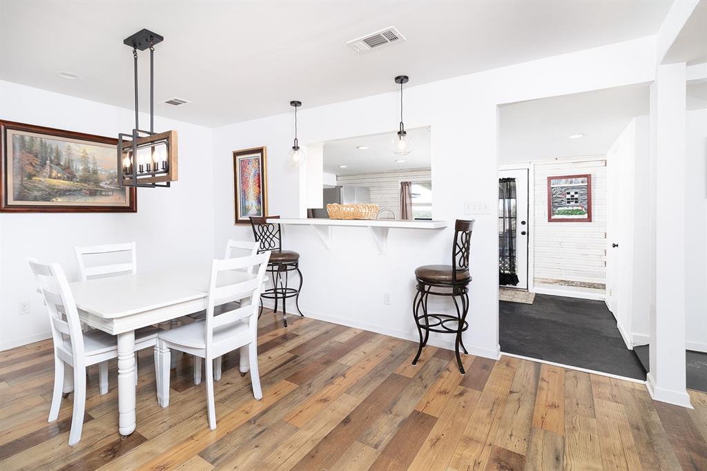 1815 South Oak Street Brady, TX 76825 - Photo 10 of 34 a view of a dining room with furniture and wooden floor
