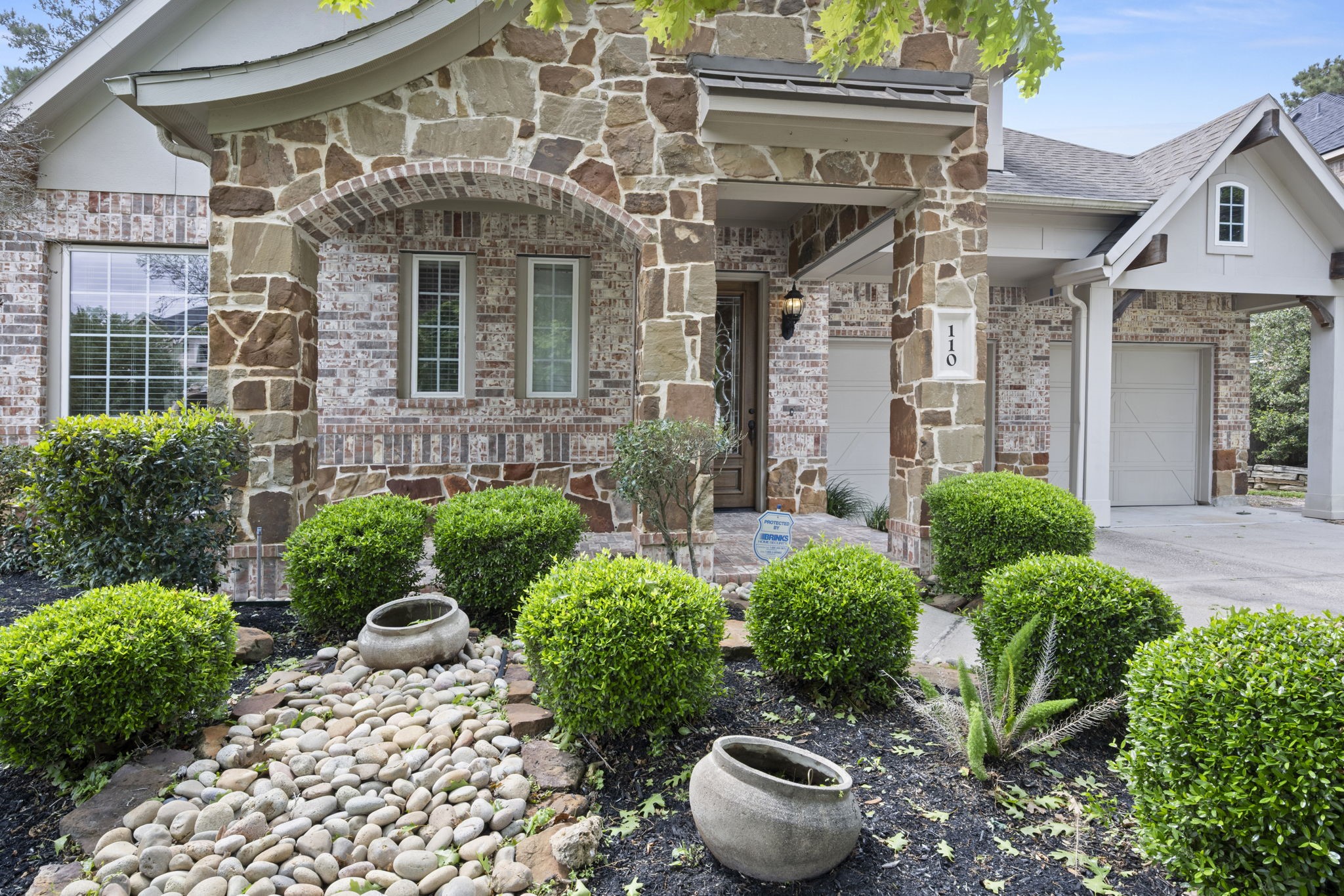 110 David Forest Lane Conroe, TX 77384 - Photo 5 of 35 a front view of a house with garden