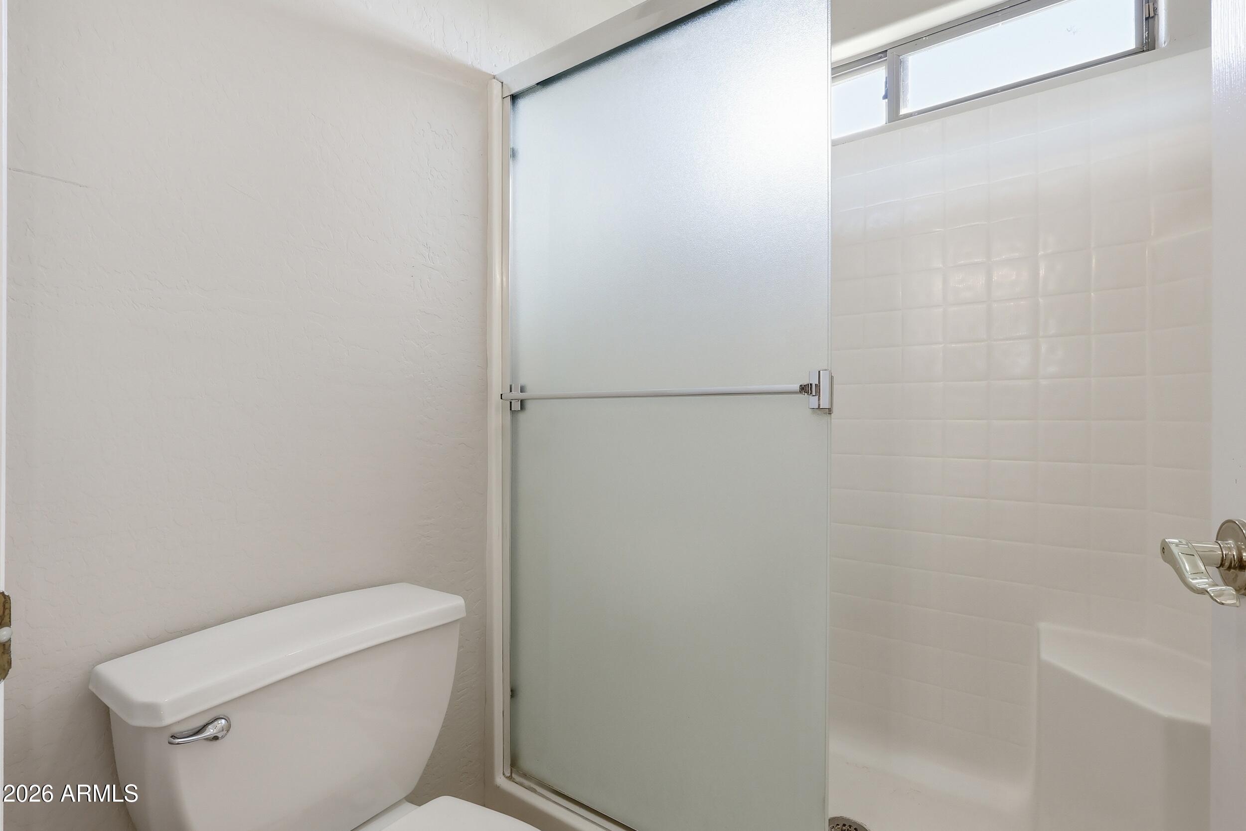 4122 South Clancy Mesa, AZ 85212 - Photo 46 of 70 a white toilet sitting next to a shower