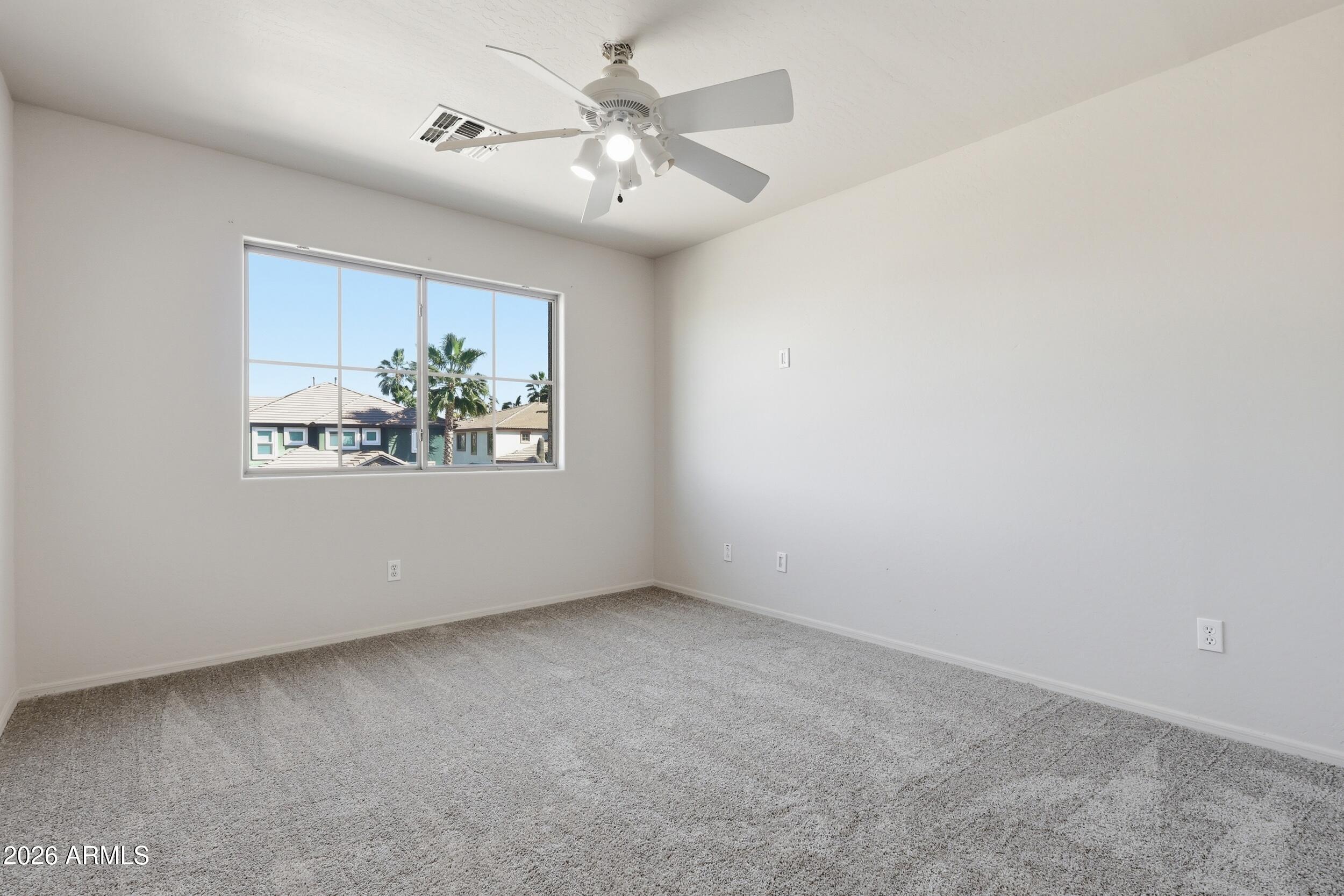 4122 South Clancy Mesa, AZ 85212 - Photo 52 of 70 an empty room with windows and ceiling fan