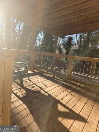 a view of a porch with wooden floor