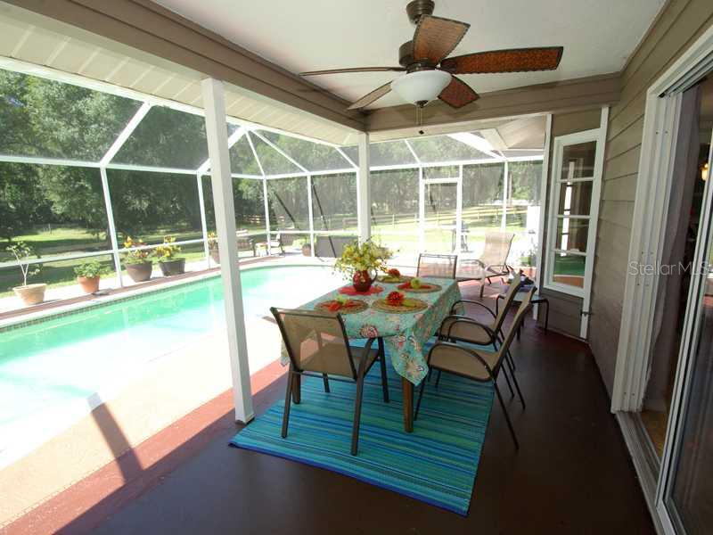 5017 Vanderipe Road Sarasota, FL 34241 - Photo 8 of 25 Lanai - There is a covered seating area in the pool cage.