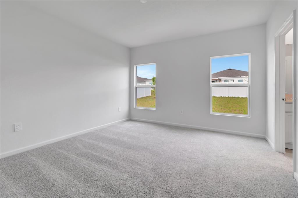 275 Puma Loop Groveland, FL 34736 - Photo 17 of 41 a view of an empty room with a window and fireplace