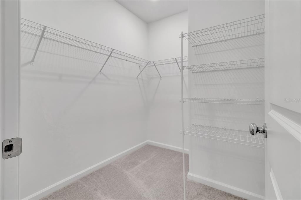 275 Puma Loop Groveland, FL 34736 - Photo 18 of 41 a view of a room with racks on the wall