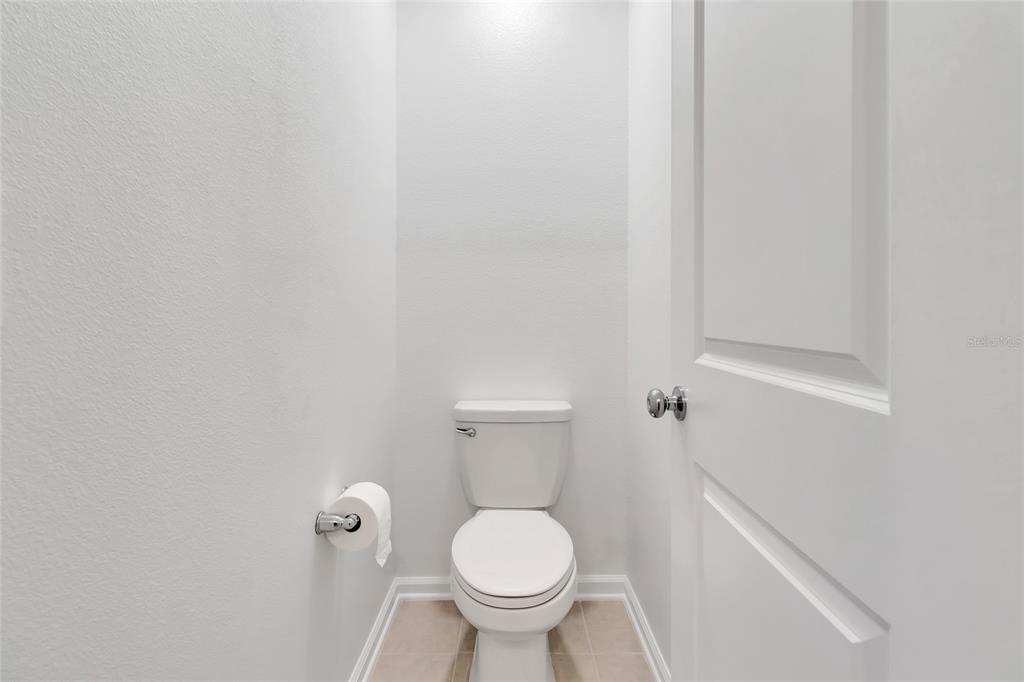 275 Puma Loop Groveland, FL 34736 - Photo 21 of 41 a white toilet sitting next to a white wall