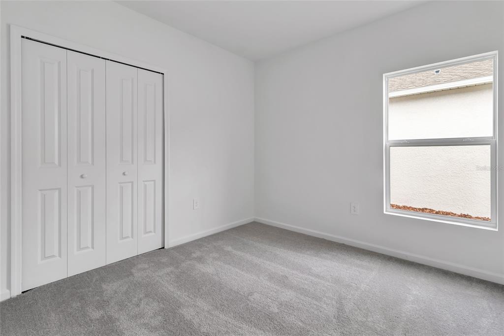 275 Puma Loop Groveland, FL 34736 - Photo 22 of 41 an empty room with a window