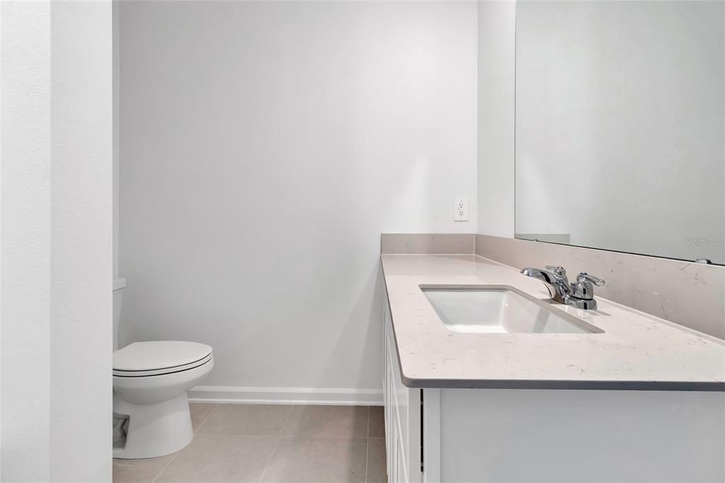 275 Puma Loop Groveland, FL 34736 - Photo 25 of 41 a bathroom with a sink and a toilet