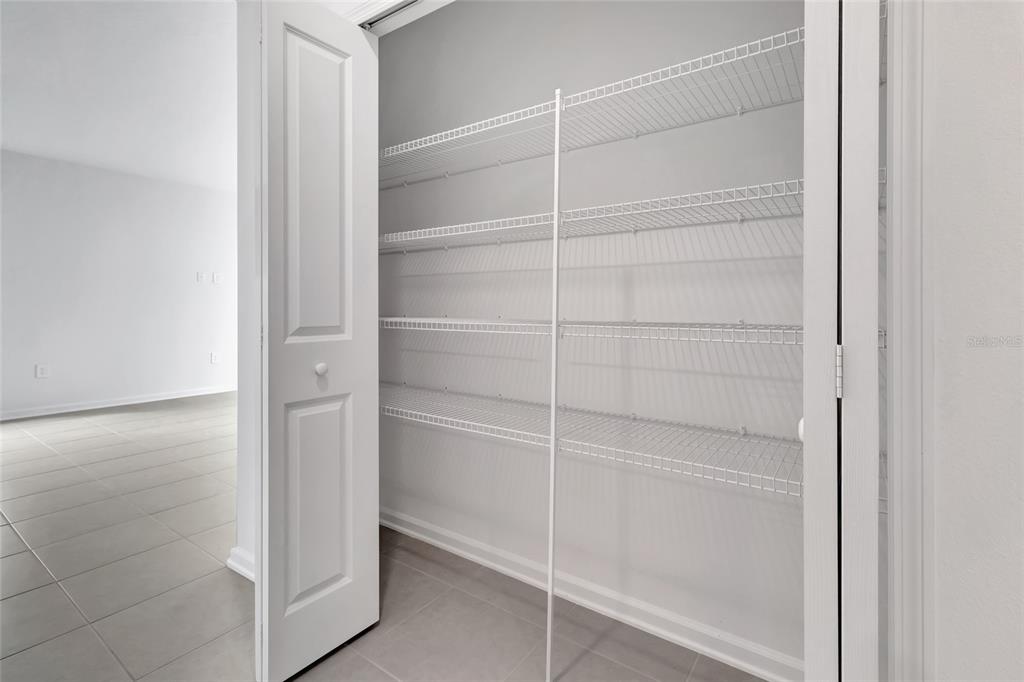 275 Puma Loop Groveland, FL 34736 - Photo 26 of 41 a view of walk in closet with empty racks