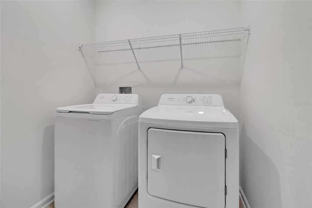 275 Puma Loop Groveland, FL 34736 - Photo 27 of 41 a utility room with dryer and washer