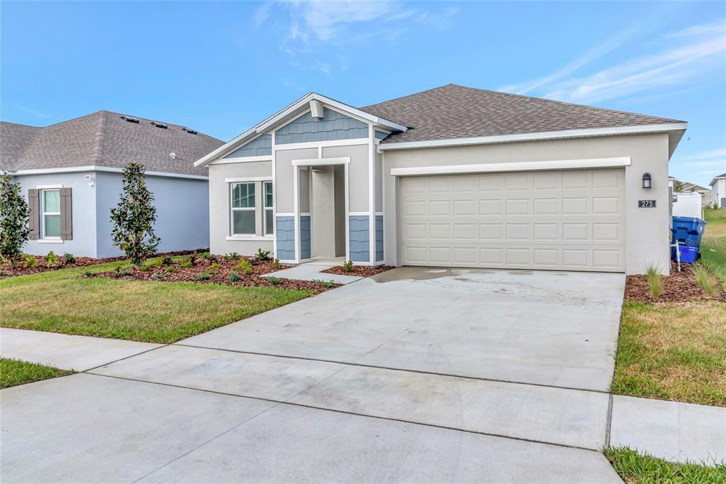 275 Puma Loop Groveland, FL 34736 - Photo 39 of 41 front view of house with a yard