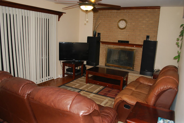 1318 Hickory Road Homewood, IL 60430 - Photo 3 of 21 a bedroom with a bed and a television