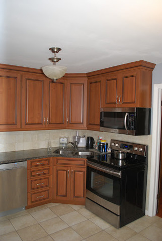 1318 Hickory Road Homewood, IL 60430 - Photo 6 of 21 a kitchen with stainless steel appliances granite countertop a stove and a microwave