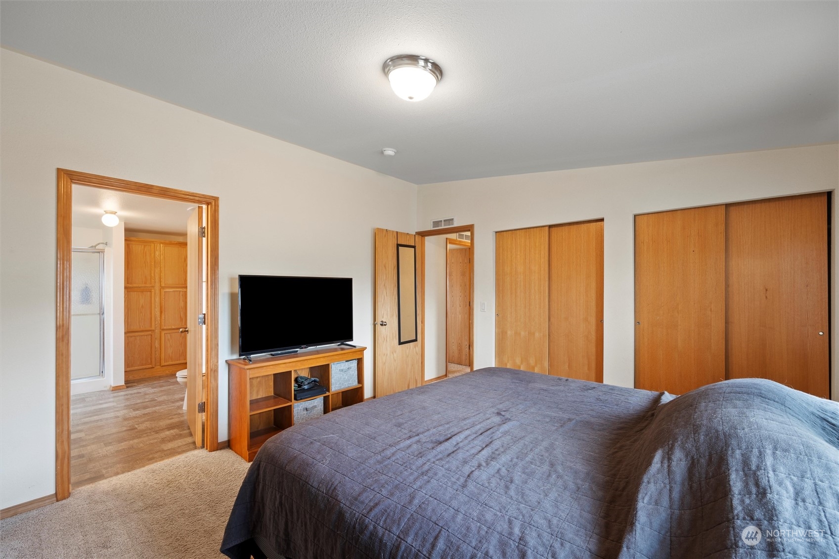 85 Second Street Touchet, WA 99360 - Photo 14 of 28 a bedroom with a bed and a flat screen tv