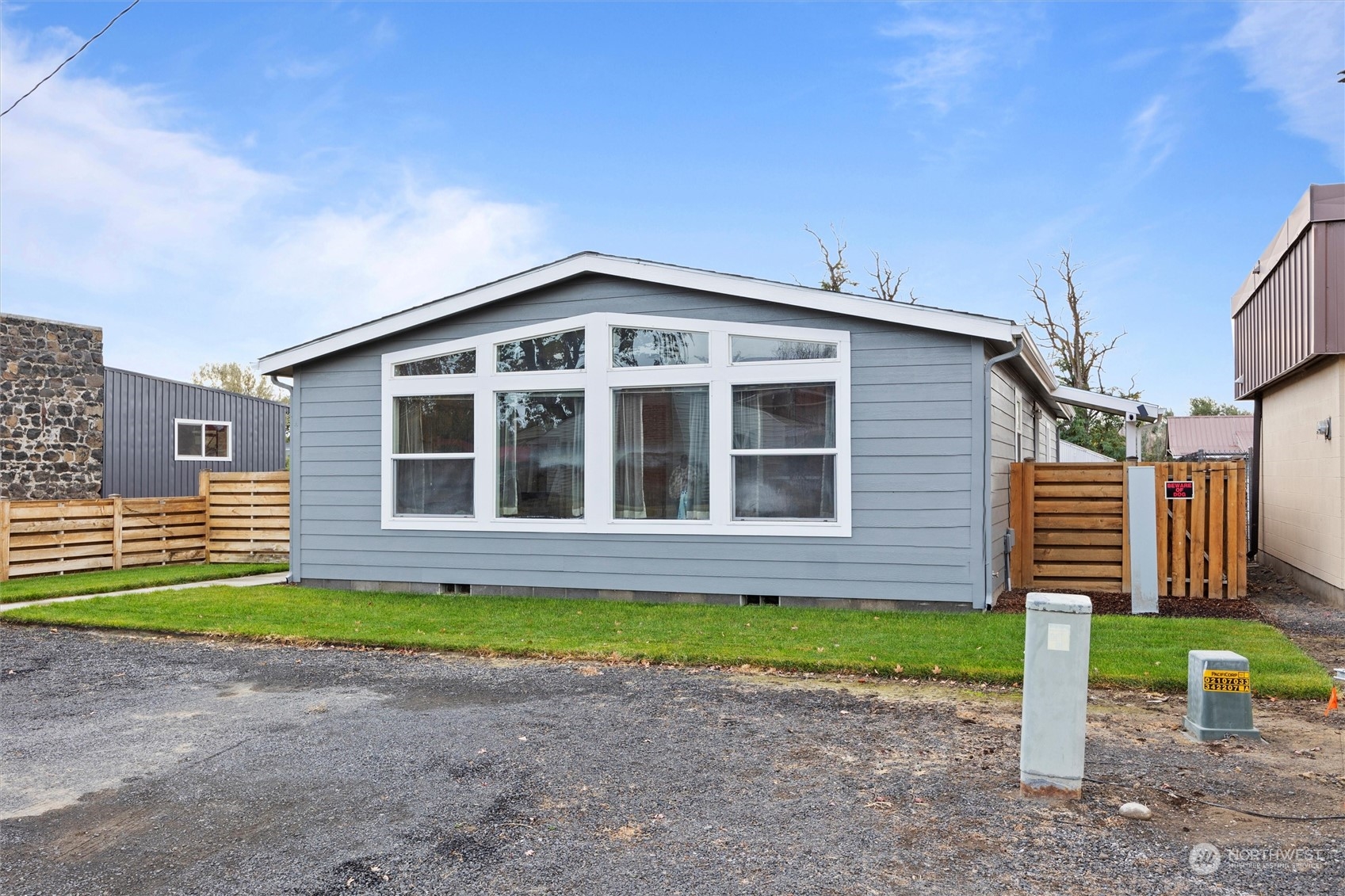 85 Second Street Touchet, WA 99360 - Photo 25 of 28 a front view of a house with a yard and garage