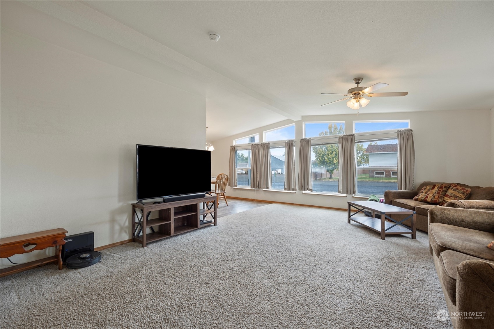 85 Second Street Touchet, WA 99360 - Photo 5 of 28 a living room with furniture a flat screen tv and windows