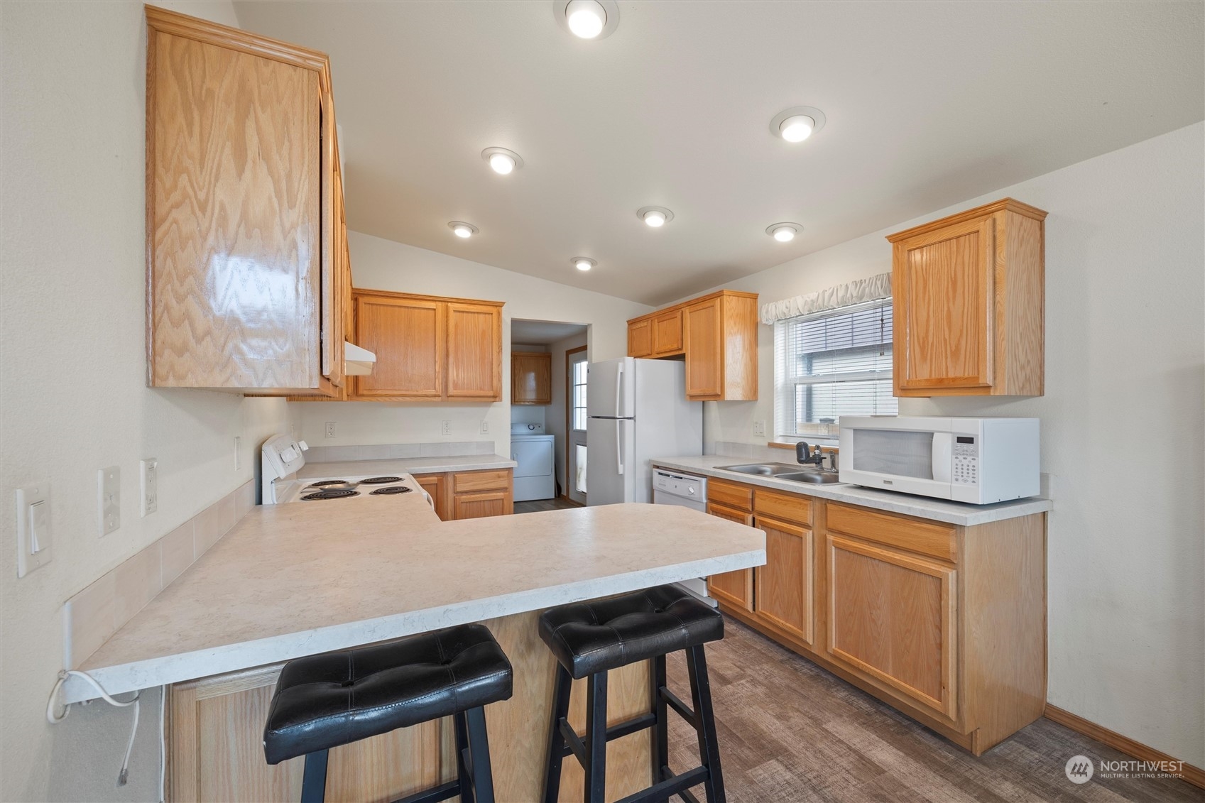 85 Second Street Touchet, WA 99360 - Photo 9 of 28 a kitchen with a table chairs sink and cabinets