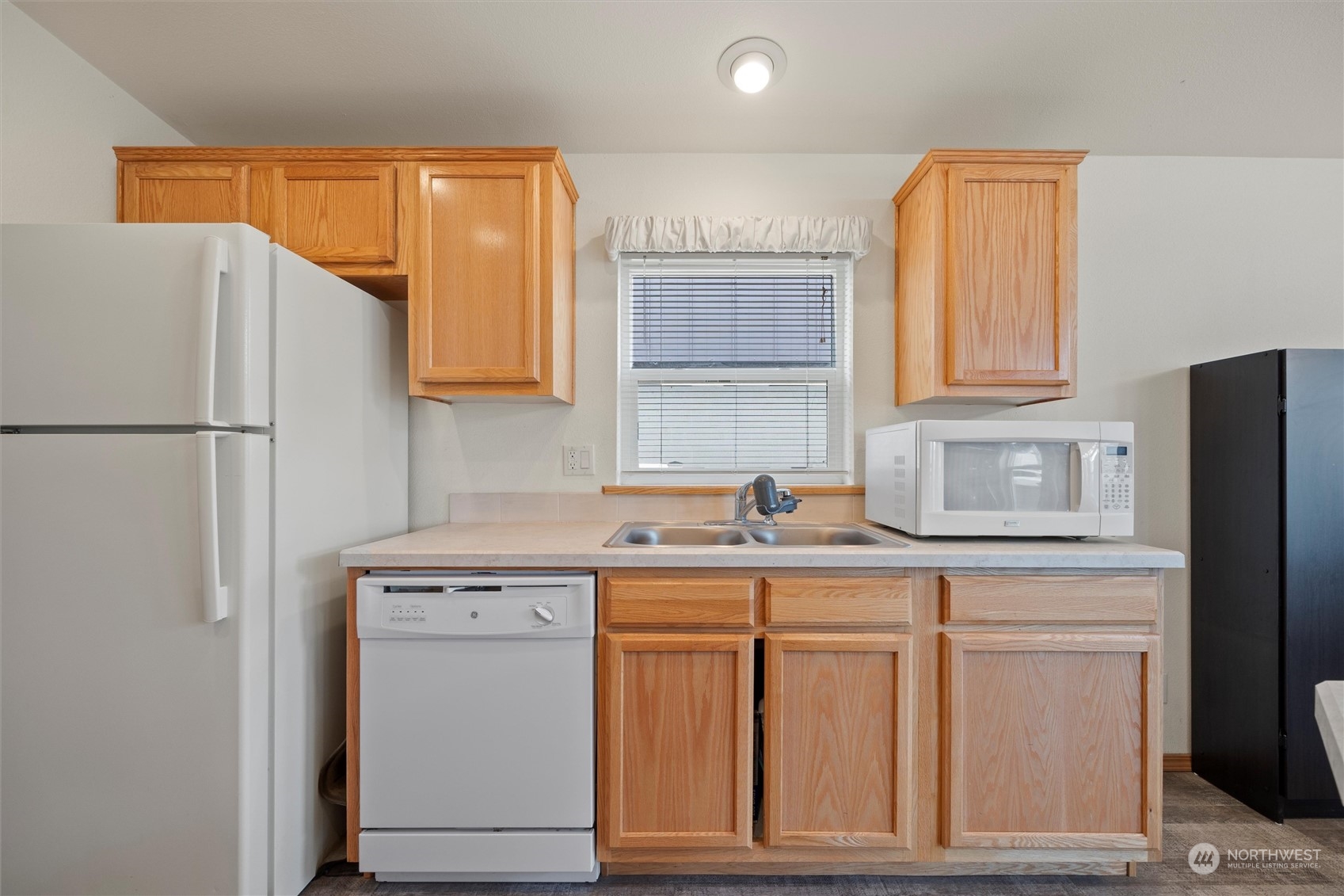85 Second Street Touchet, WA 99360 - Photo 10 of 28 a kitchen with stainless steel appliances granite countertop a refrigerator sink and cabinets