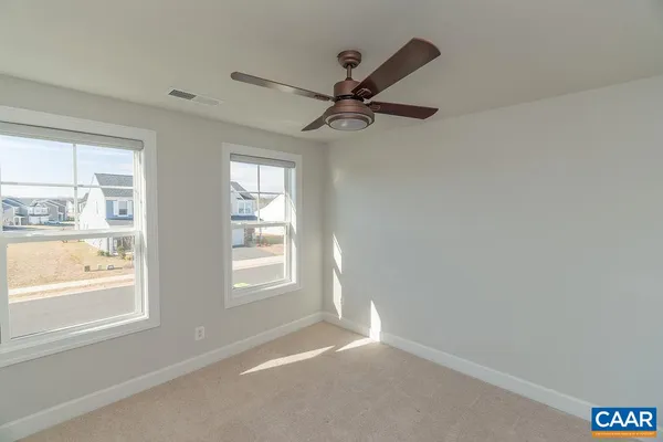 a view of empty room with windows