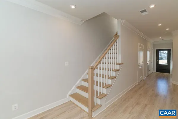 a view of entryway with wooden floor