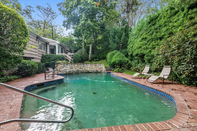 a view of a house with swimming pool