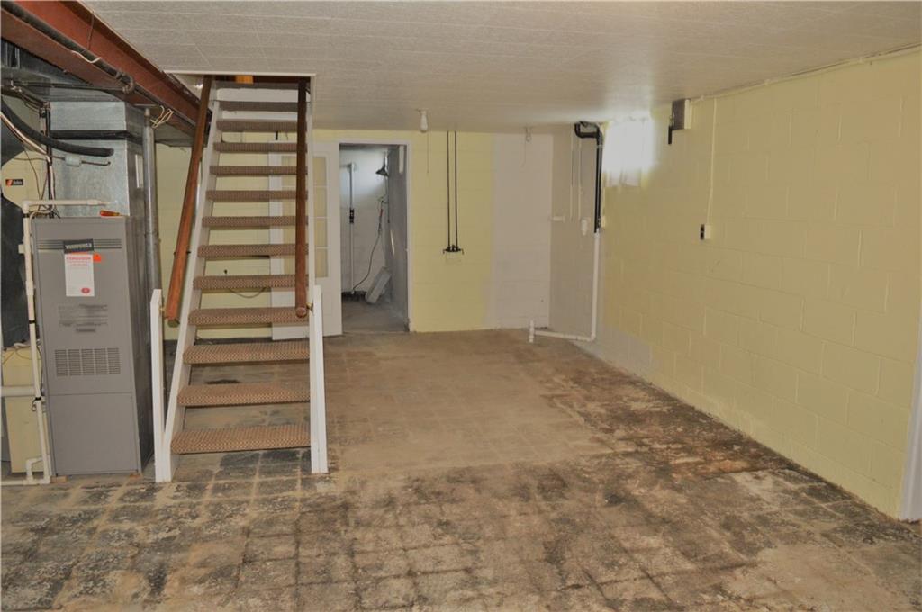 2073 Silverville Road Freeport, PA 16229 - Photo 20 of 25 View of one half of basement from Integral Garage. Door is to storage room under side porch.