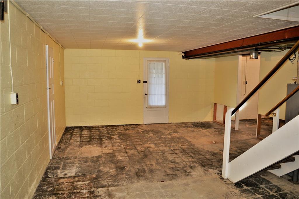 2073 Silverville Road Freeport, PA 16229 - Photo 21 of 25 View from Storage Room under Side Porch. Door on Left is storage room under front porch steps. Door in Front is to Integral Garage.