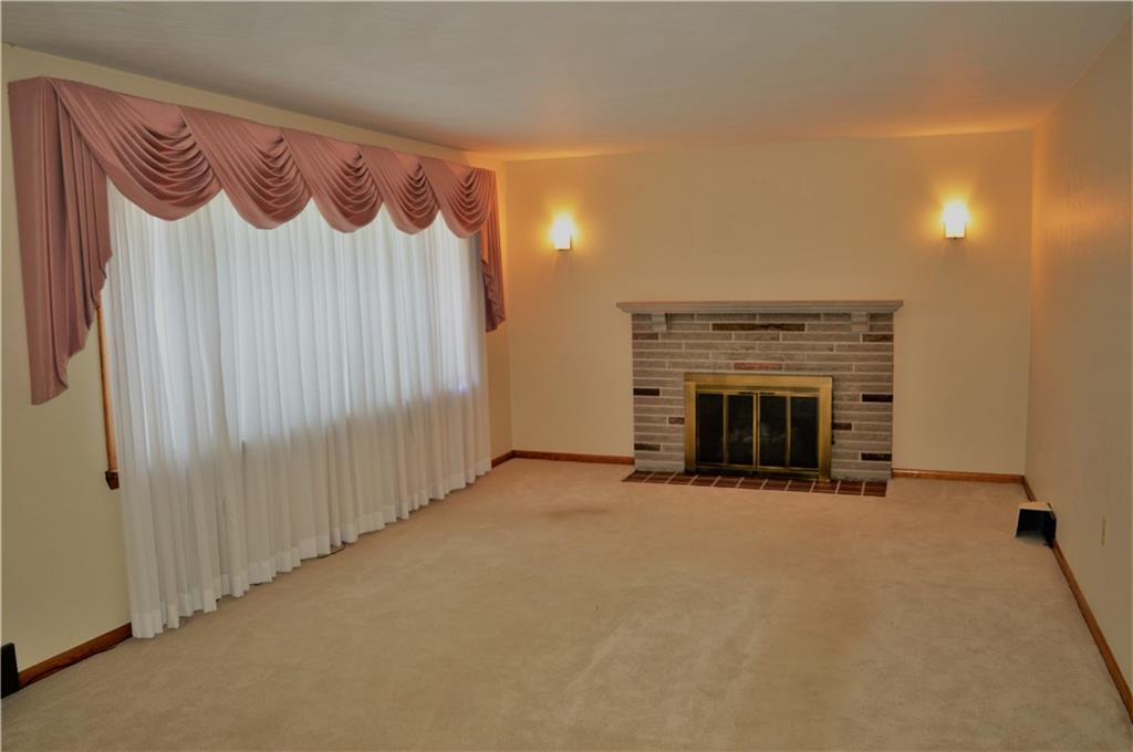 2073 Silverville Road Freeport, PA 16229 - Photo 5 of 25 Living Room With Large Window and Fireplace, Looking from Kitchen