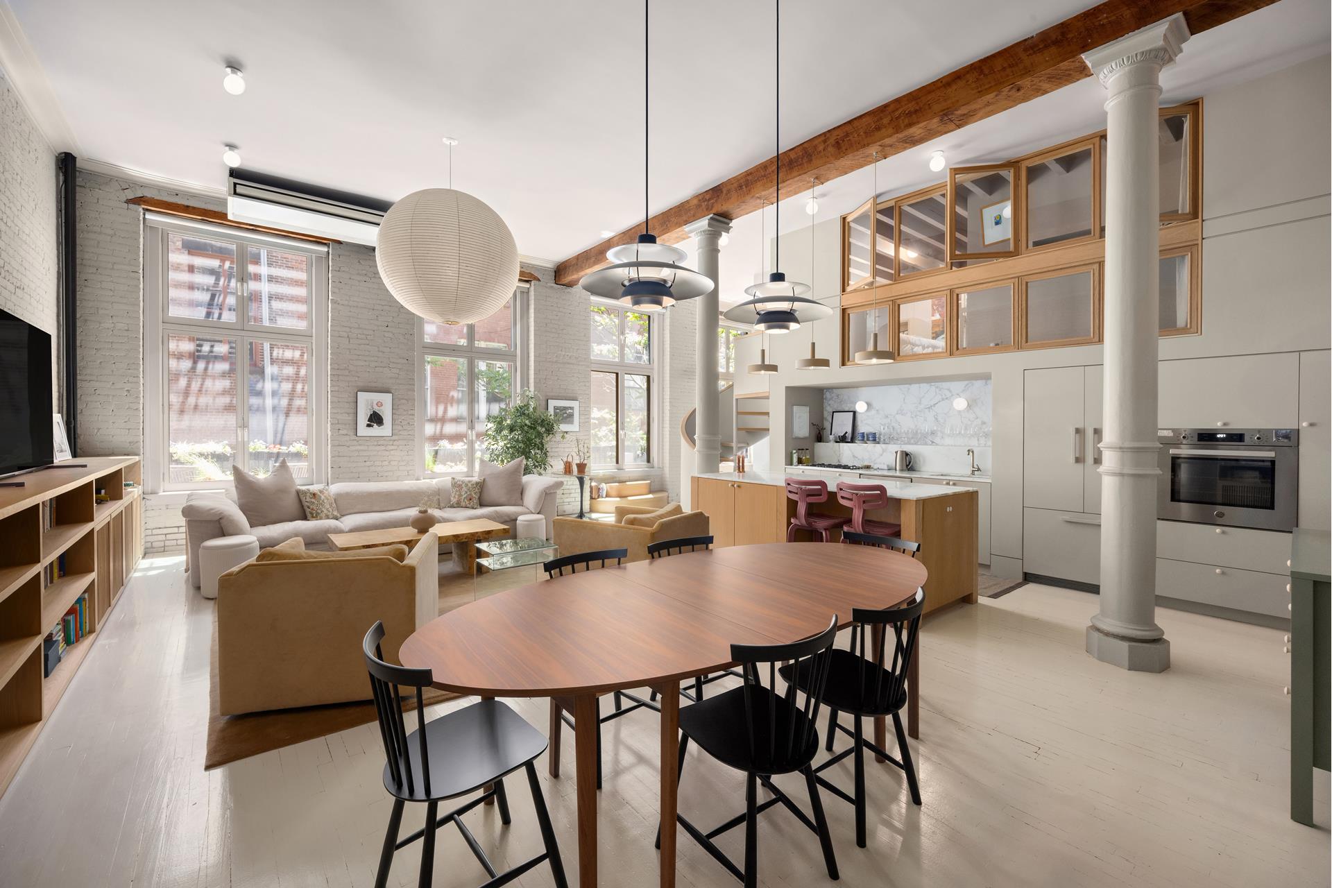 134 Greene Street, Unit 3R Manhattan, NY 10012 - Photo 2 of 25 a dining room with furniture and window
