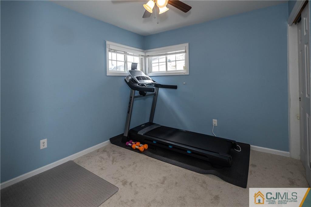 69 Ashley Road Edison, NJ 08817 - Photo 16 of 35 a room with gym equipment and a window
