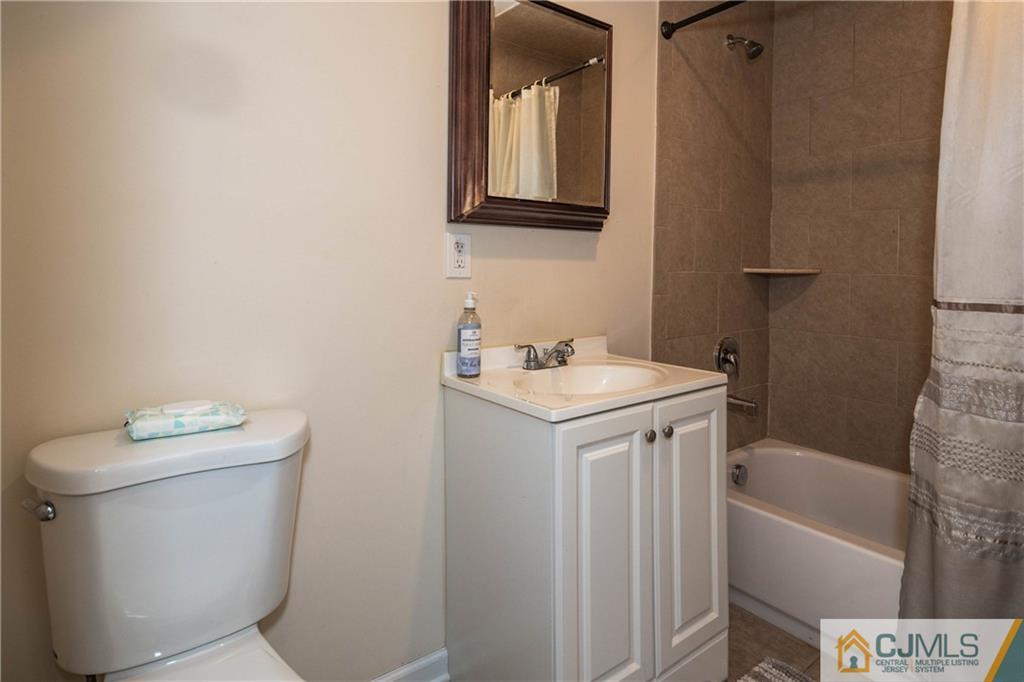 69 Ashley Road Edison, NJ 08817 - Photo 17 of 35 a bathroom with a sink a toilet and shower